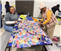 Volunteers create no-sew blankets