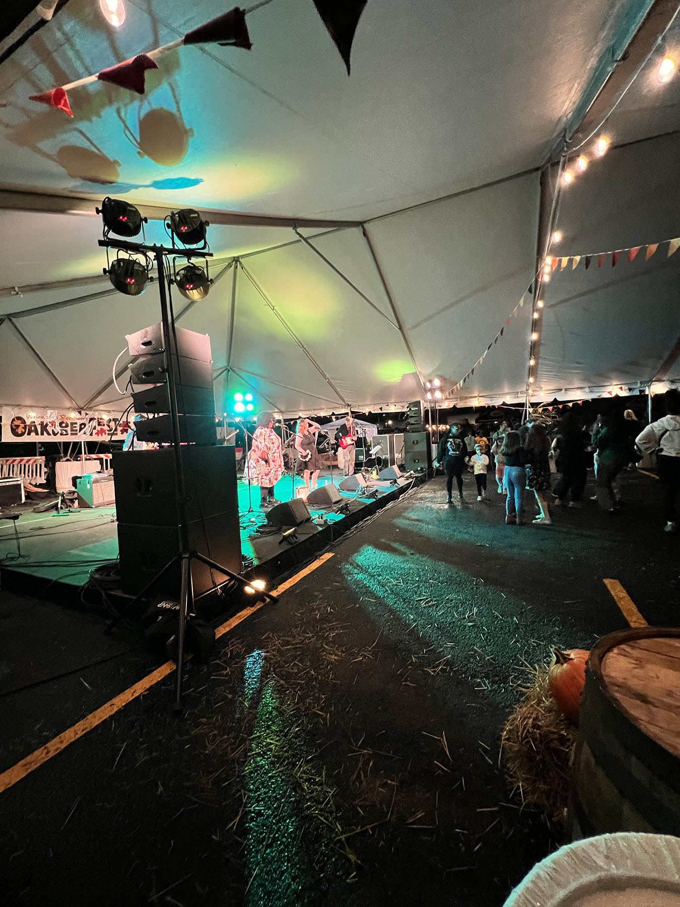 Band plays under a giant tent at OAKtoberfest event in 2024